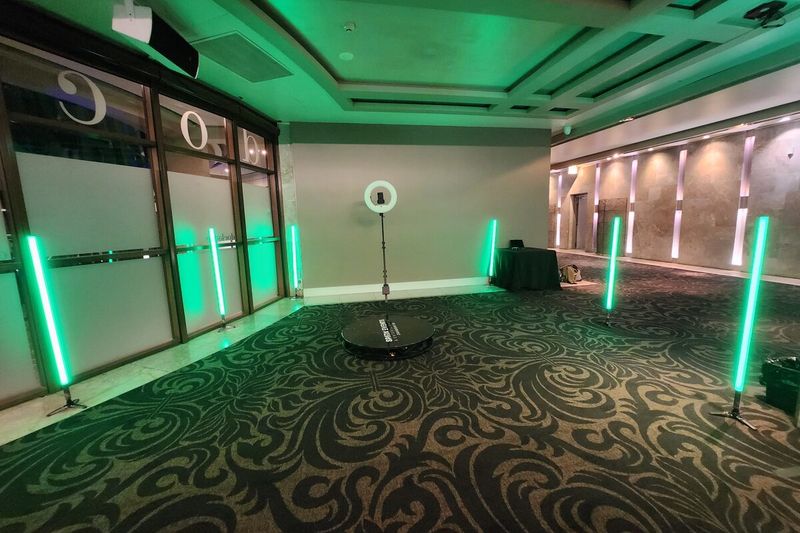 360 booth with green LED tubes matched to a green ballroom