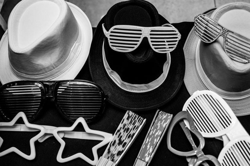 Hats and novelty glasses laid out from the photo booth props box