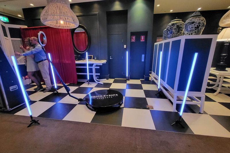 360 booth lit with blue LED tubes above a chequerboard floor
