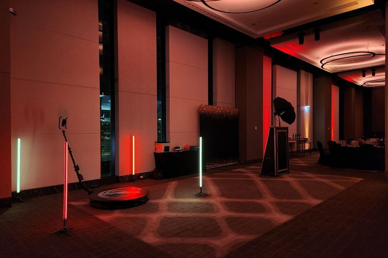 360 booth set up in a function room lit in deep red